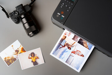 Printer and photo camera on table. Printing photos concept