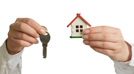 A female hands in a white shirt holding a small house and a key