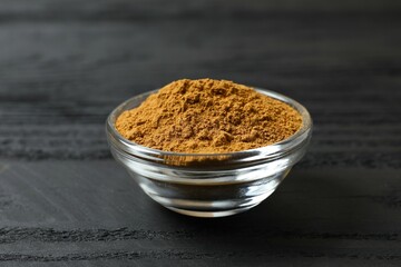 Aromatic cinnamon on a wooden background