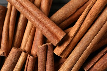 Aromatic cinnamon on a wooden background