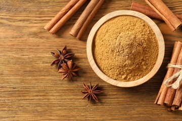 Aromatic cinnamon and anise stars on a wooden background