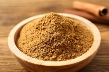 Aromatic cinnamon on a wooden background
