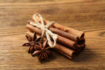 Aromatic cinnamon and anise stars on a wooden background