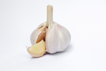 Garlic cloves, Chinese garlic. On white background dry food ingredients. For presentation, food, education, and garlic advertising.
