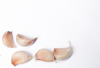 Garlic cloves, Chinese garlic. On white background dry food ingredients. For presentation, food, education, and garlic advertising.