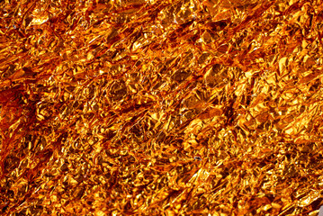 Abstract gold textured background with warm tones