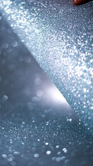 Silver glitter background texture white sparkling shiny wrapping paper for Christmas holiday seasonal wallpaper decoration, greeting and wedding invitation card design element