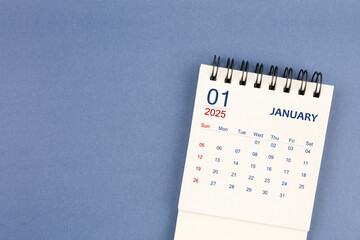 January 2025 Mini monthly desk calendar for 2025 year on blue color background.