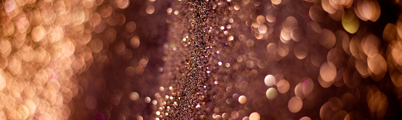 Golden falling glitter on the black background, festive overlay