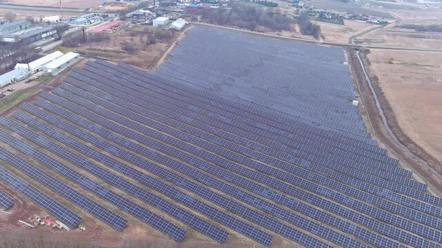 Aerial view of solar panel farm in expansive area - Kaunas Free Economic Zone (LEZ)