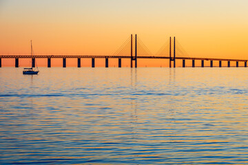 Sunset view of the Oresund bridge from the swedish shore, a railway and motorway cable-stayed bridge across the Oresund strait between Denmark and Sweden, opened to traffic in 2000.