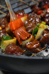 Christmas and New Year's dishes, consisting of meat satay with fried vermicelli and vegetables