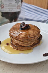 photo of pancakes with dried prune topping, added honey as a sweetener to add to the enjoyment of eating
