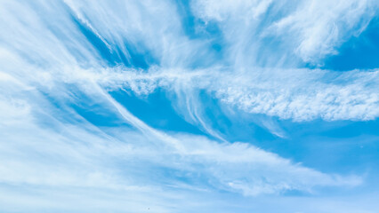 Large clouds floating in the blue sky with copy space.The weather is clear today.subtle background.
