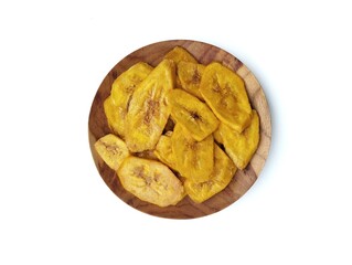 Keripik pisang or sweet banana chips on plate isolated on white background with top view angle setup, Indonesian traditional foods 