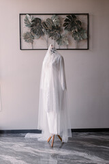 Elegant white Malay Muslim woman's wedding dress