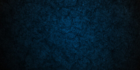 Grunge dark blue rock studio stucco antique grunge spot light backdrop background. concrete distressed gradient limestone sketch wall rough blank aged texture background.