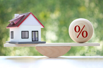 Estate tax,Model house with Percentage symbol icon on green background,Business investment and Property tax concept