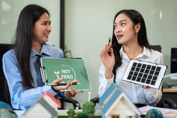 Businessman team brainstorming using computer on CO2 emission reduction concept. along with...