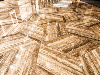 Elegant patterned flooring featuring geometric shapes and polished texture for interior design...