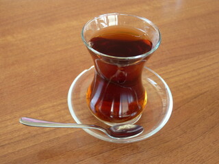 A Glass of Turkish Tea: Symbol of Warm Hospitality and Connection, Reflecting Türkiye’s Rich Culture and Timeless Traditions at the Heart of Every Conversation.