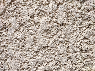 Textured wall surface with a rough finish suitable for displaying information or art