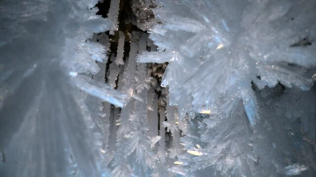 Blue crystal icicles, ice snowflakes on stalactites inside frozen cave 