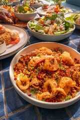 High angle, Deep-fried seafood with chili and salt in plate on blue tiled surface, Thai dish