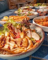 Close up, Grilled mushrooms and chicken breast salad on blue tiled surface