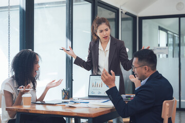 Business Meeting Tension: A tense moment in the office, as a business leader delivers a passionate...