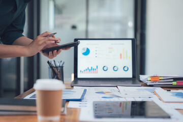 Analyzing the Data: A close-up shot of a professional's hand, meticulously analyzing a laptop...