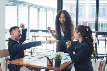Triumphant Team Fist Bump: Celebrating Success in the Modern Workplace 