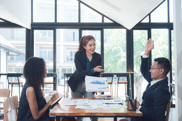 Dynamic Business Meeting: A diverse team collaborates during a productive meeting, showcasing engagement and insightful discussion.  