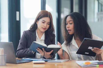 Collaborative Businesswomen Reviewing Documents 
