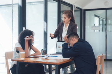 The Pressure's On: A tense moment in a corporate setting, where a frustrated manager confronts a...
