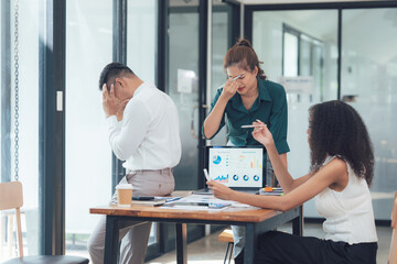 Stressful Business Meeting: A diverse team struggles with a project, overwhelmed by challenges and...