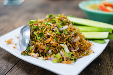 Thai food Small fish fried herbs,spicy salad with small fish. Spicy and sour small fish salad