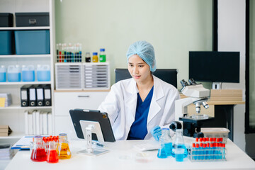 female scientist working with micro pipettes analyzing biochemical