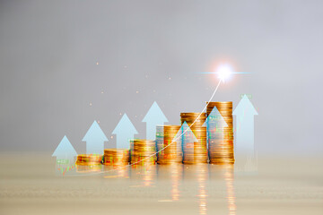 Gold Coins are laid out in graph Arrows shooting up. Growing power of compound interest concept. ...
