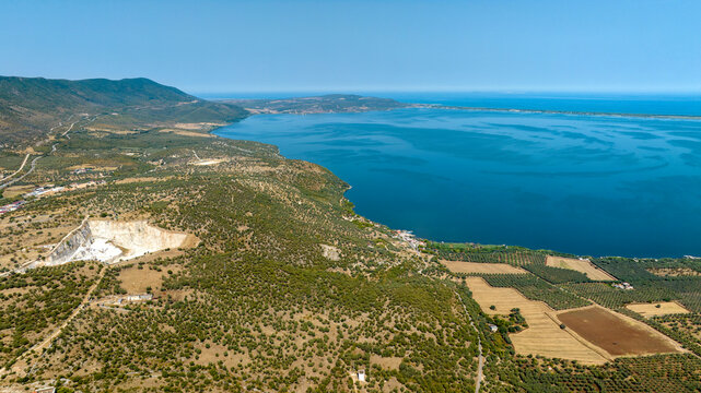 Aerial view of Varano Lake. It is a coastal lake located in the province of Foggia, in Gargano, Puglia, Italy. In the background is the Adriatic Sea.