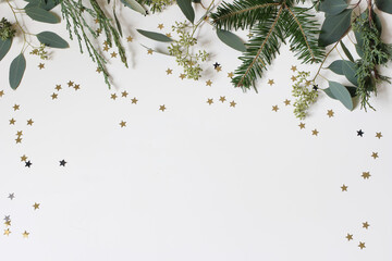 Christmas, New Year decorative frame. Festive web banner. Green garland of eucalyptus, fir, cypress...