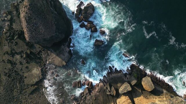 Aerial view of Papuma Beach Jember East Java with rocky beach fishing boat waves water
