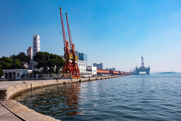 Warehouse and old port of Rio de Janeiro with oil platform in the background, tourist spot near the...
