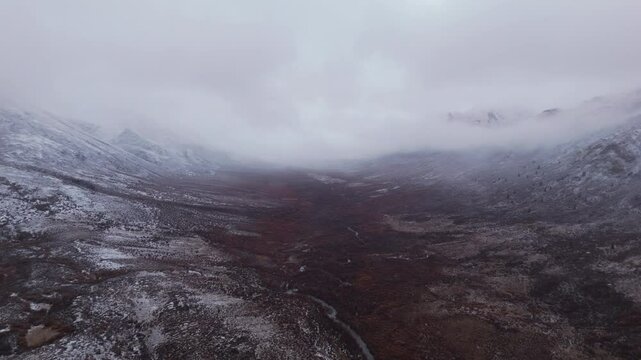 Cloudy Sky Over Ogilvie Mountain Range During Winter In Yukon, Canada. Aerial Drone Shot