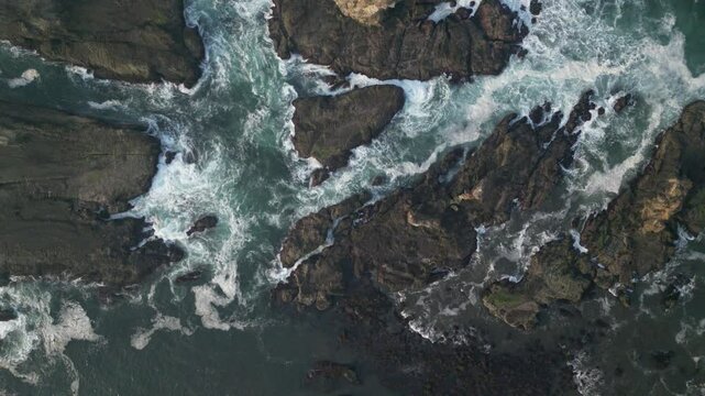 Aerial view of Papuma Beach Jember East Java with rocky beach and fishing boat on waves