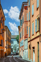 City street displaying vibrant architecture and inviting atmosphere in Modena during a sunny day. Modena. Emilia-Romagna. Italy