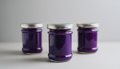 Few jar of purple plum or blueberry jam. Homemade fruit preserve. Sweet and healthy food.