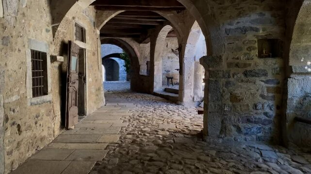 Passage under the ancient stone arches at Cornello dei Tasso in the Brembana valley, Bergamo, Italy