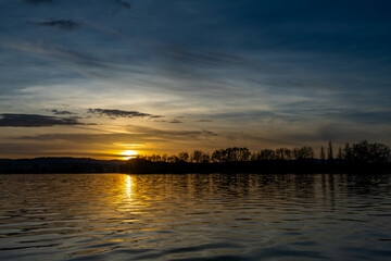 Vysatov pond with sunset color light in autumn sunny evening