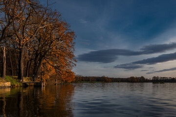 Vysatov pond with sunset color light in autumn sunny evening